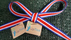 UpTica tags and ribbon sporting the colors of the Costa Rican flag