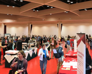 The exhibitor hall at Monona Terrace, with refreshments in the center. 