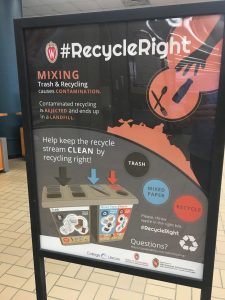 Informational posters about the #RecycleRight campaign compliment bin signs and table tents at College Library. Image courtesy of Carrie Kruse.