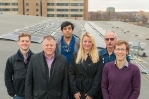 Members of Helios, Housing, Facilities Planning & Management, and the Office of Sustainability gather on the roof of Gordon Dining & Event Center. Left to right: Zach Galvin, David Darling, Sahil Verma, Breana Nehls, Stu Larose, Ian Aley.