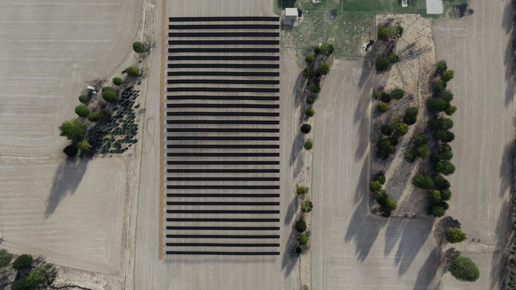 Digital rendering of a solar array from the air, showing black lines of panels and scattered trees in an agricultural landscape