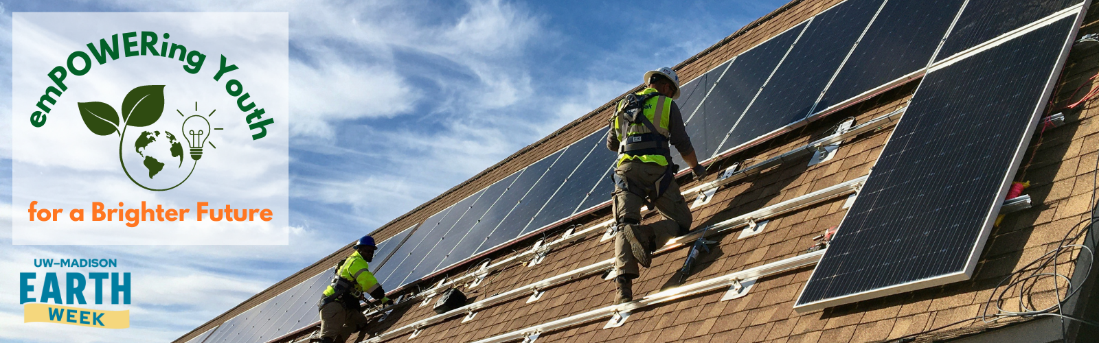 Workers on a rooftop installing solar panels